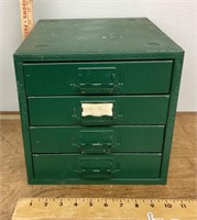 Small green metal parts drawers