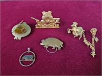 Goldtone piggy pins and pendant