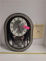 Cuorum Small World Rhythm Magic Motion Clock