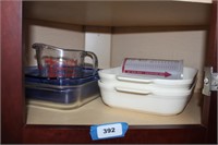 4 casserole dishes in corner cabinet of kitchen