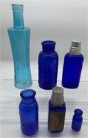 6 assorted blue glass bottles some w/advertising