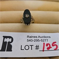 14 KT marked white gold ring with dark stone