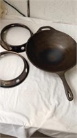Cast iron wok with two stove top wok extension