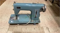 Vintage Brother model C blue sewing machine.