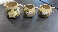 Three Stoneware Pitchers