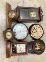 Tote of 7 old clocks for parts