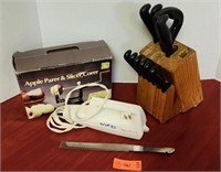 Knife block, & Electric Knife. Turns on. And apple
