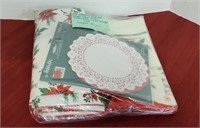 1 plastic and 1 paper Christmas tablecloths
