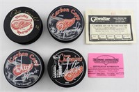 (4) NHL RED WINGS' UNIDENTIFIED AUTOGRAPH PUCKS
