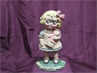 Antique cast iron doorstop. Girl w/doll.