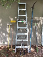 Ladder, rake, brushes and branch saw