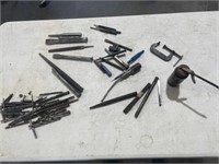 Assorted drill bits, punches, and oil can