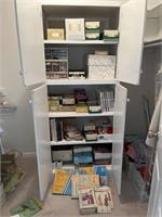 Cabinet full of sewing notions and other items