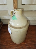 Tan unmarked pottery jug