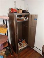 Metal Wardrobe With Items Inside And On Top