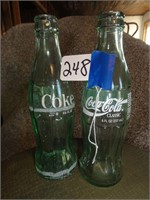 2 Coca-Cola Bottles