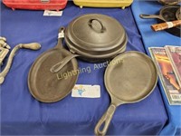 THREE CAST IRON PANS