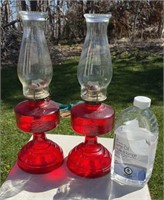 Cranberry glass oil lamps. Good condition w/oil