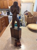 Wooden statue and pipe holder