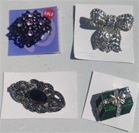 Four Brooches In New Condition