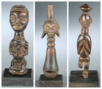 Congo figure with decorative sculptures.
