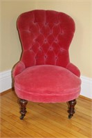 Velvet button tufted back parlor chair on casters,