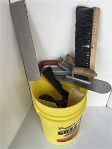 Yellow pail full of concrete tools