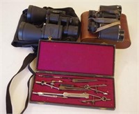 Two cased binoculars & a drafting set