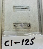 C1-125 sterling ring w/7 clear stones in shape