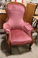 ANTIQUE UPHOLSTERED HIGH BACK ARM CHAIR