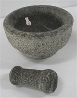 Stone mortar and pestle. Measures 4 1/2" H x 8