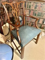 Antique walnut armchair with green seat