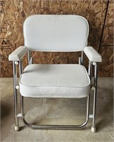 white cushion folding chair