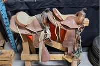 PAIR OF MATCHING HORSE SADDLES & STAND