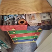 Heavy-duty cardboard chest with sewing items.