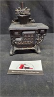Vintage cast iron miniature Queen wood stove