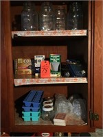 canning jars, light bulbs, contents of cabinet