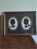 Silhouette picture and framed flower picture.