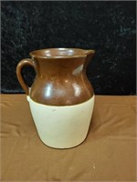 Brown and white USA pottery pitcher approx 10