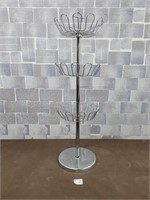Metal stand. Fruit, hats/gloves, or shop items