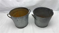 Two metal buckets