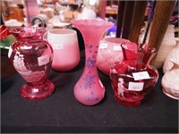 Five pink and red vases including two in Mary