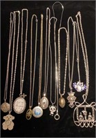Silver tone necklaces with large pendants