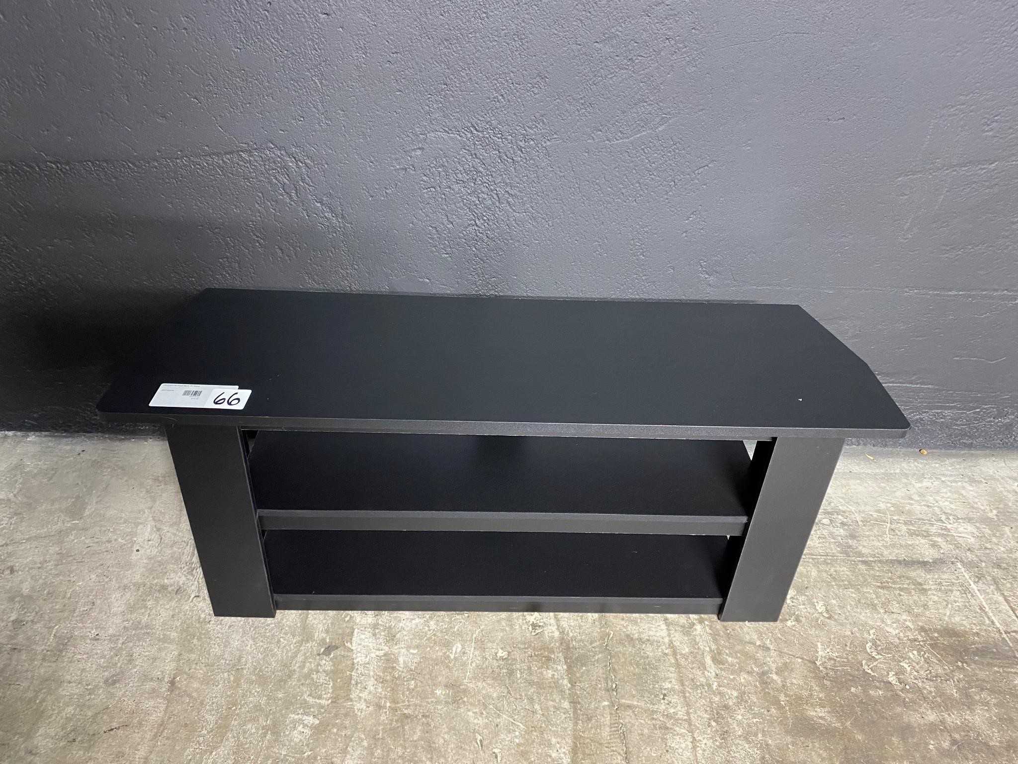 Small black TV stand.
