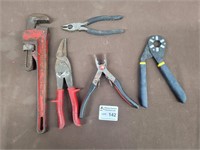 Plyers, pipe wrench, and more tools