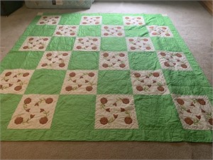 Handmade quilt, green with red and cream flowers