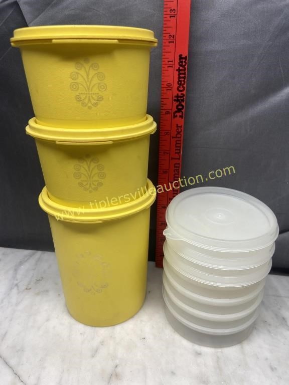 Small yellow Tupperware canisters and extra lids