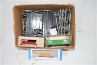 Box of HO Train Tracks and 3 New Plastic HO Trains