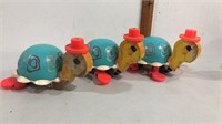 1962 fisher price turtle pull toys.  1 is missing