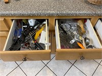 Two drawers full of kitchen utensils